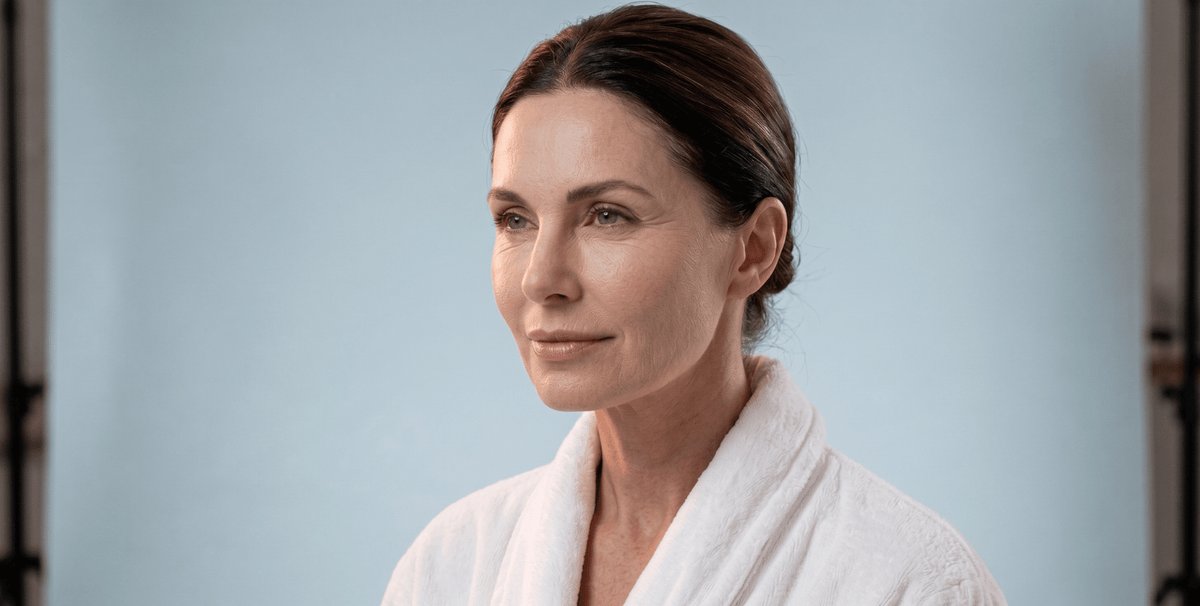 Close-up of woman’s face showing visible fine lines and wrinkles, highlighting signs of premature skin aging and loss of firmness.