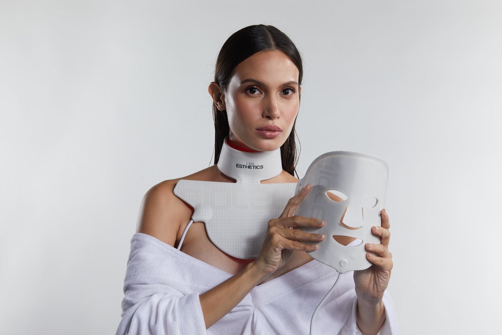 woman holding face mask